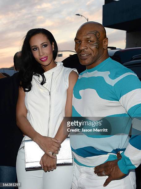 Actor Mike Tyson and Kiki Tyson arrive at the Dimension Films' 'Scary Movie 5' premiere at the ArcLight Cinemas Cinerama Dome on April 11, 2013 in...