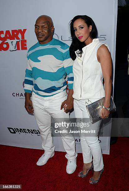 Actor Mike Tyson and Kiki Tyson arrive at the Dimension Films' 'Scary Movie 5' premiere at the ArcLight Cinemas Cinerama Dome on April 11, 2013 in...