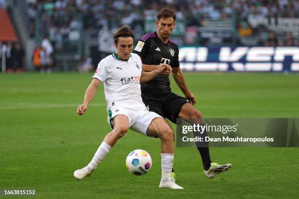 Leon Goretzka of Bayern Munich battles for the ball with Rocco Reitz of Borussia Mönchengladbach during the Bundesliga match between Borussia...