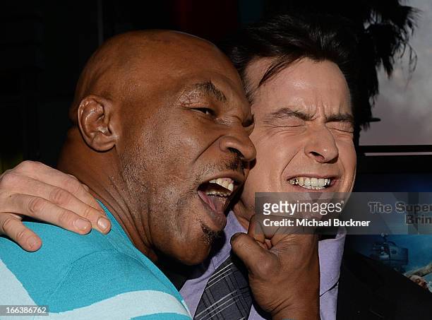 Former professional boxer Mike Tyson and actor Charlie Sheen arrive for the premiere of Dimension Films' "Scary Movie 5" at ArcLight Cinemas Cinerama...