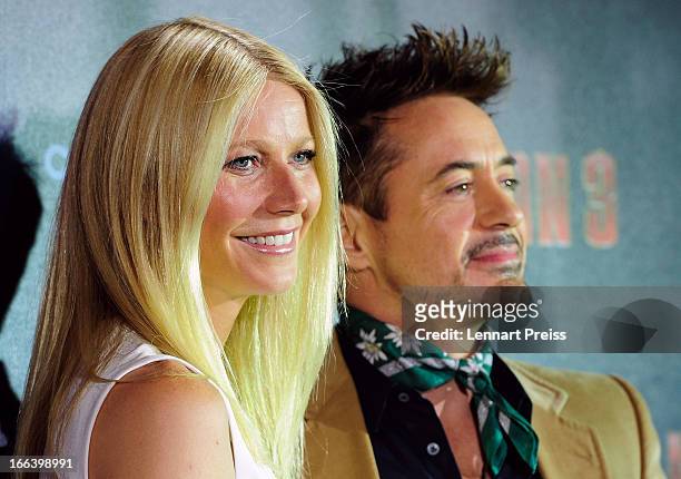 Actors Robert Downey Jr. And Gwyneth Paltrow pose during the "Iron Man 3" photocall at Hotel Bayerischer Hof on April 12, 2013 in Munich, Germany.