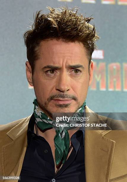 Actor Robert Downey Jr. Poses during the "Iron Man 3" photocall in Munich, southern Germany, on April 12, 2013. The movie will open on May 1, 2013 in...