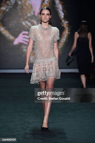 Collette Model A model showcases designs by Collette Dinnigan on the runway at the ...