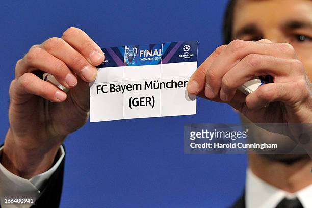 Ruud van Nistelrooy shows the name FC Bayern Munchen during the UEFA Champions League semi-final draw at the UEFA headquarters on April 12, 2013 in...