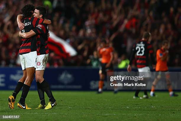 Nikolai Topor-Stanley and Michael Beauchamp of the Wanderers celebrate victory during the A-League Semi Final match between the Western Sydney...