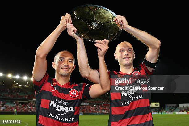 Shinji Ono of the Wanderers poses with team mate Dino Kresinger and the Premier's Plate after winning the A-League Semi Final match between the...