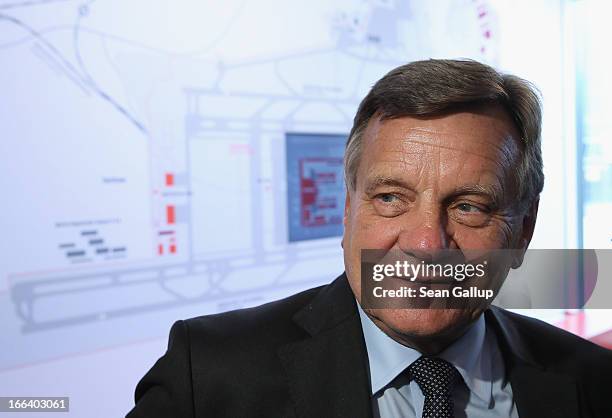 Hartmut Mehdorn, head of the management board of Berlin's new Willy Brandt Berlin Brandenburg International Airport, stands next to a map of the new...