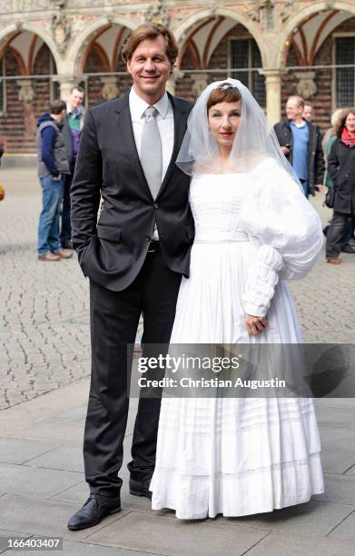 Meret Becker and Thomas Heinze attend a photocall for "Luegen" in front the Town Hall of Bremen on April 12, 2013 in Bremen, Germany.