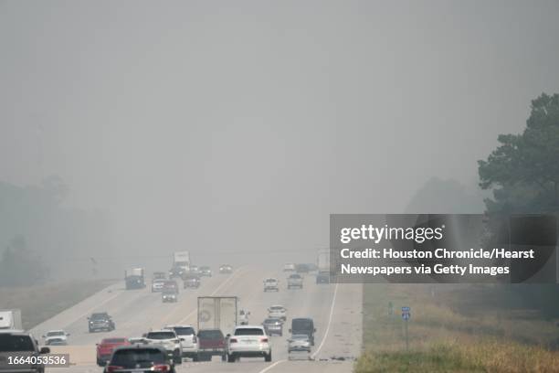 Smoke from a wildfire in rural Walker County shrouds portions of I-45 Saturday, Sept. 2, 2023 near Huntsville.