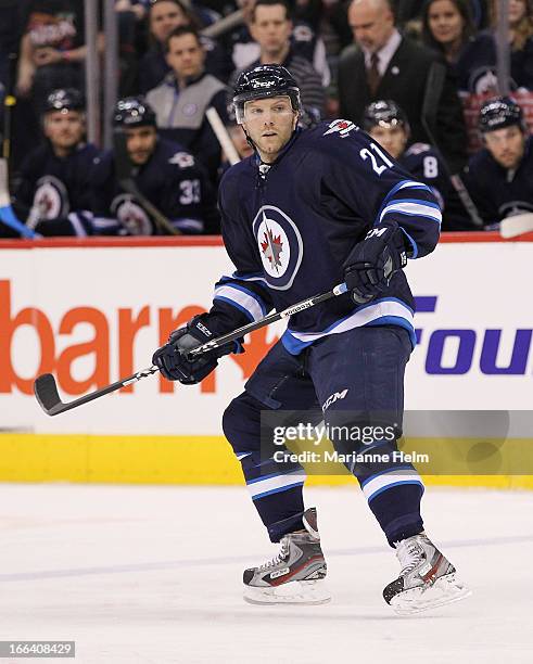 Aaron Gagnon of the Winnipeg Jets keeps his eyes on the play as he skates down the ice during second period action in a game against the Buffalo...