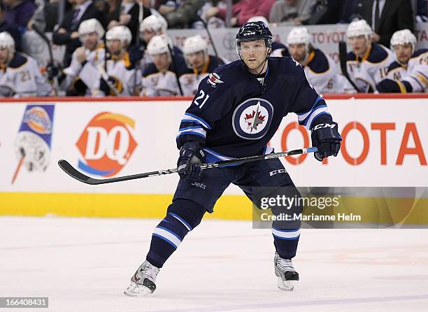 Aaron Gagnon of the Winnipeg Jets keeps his eyes on the play as he skates down the ice during second period action in a game against the Buffalo...