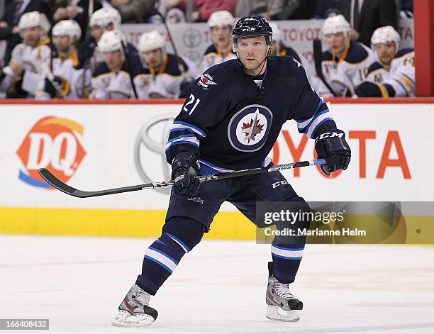 Aaron Gagnon of the Winnipeg Jets keeps his eyes on the play as he skates down the ice during second period action in a game against the Buffalo...