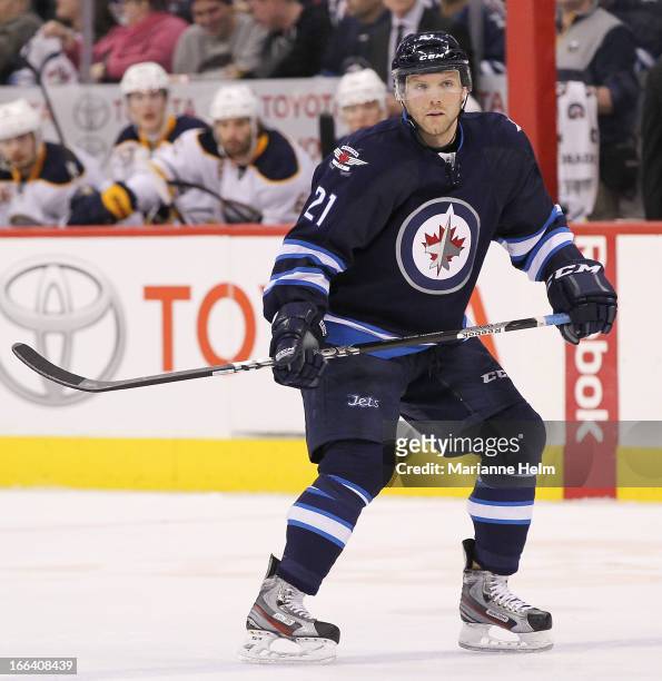 Aaron Gagnon of the Winnipeg Jets keeps his eyes on the play as he skates down the ice during second period action in a game against the Buffalo...