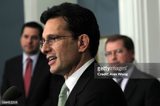 House Majority Leader Rep. Eric Cantor speaks as Grover Norquist , president of Americans for Tax Reform listens during a news conference April 12,...