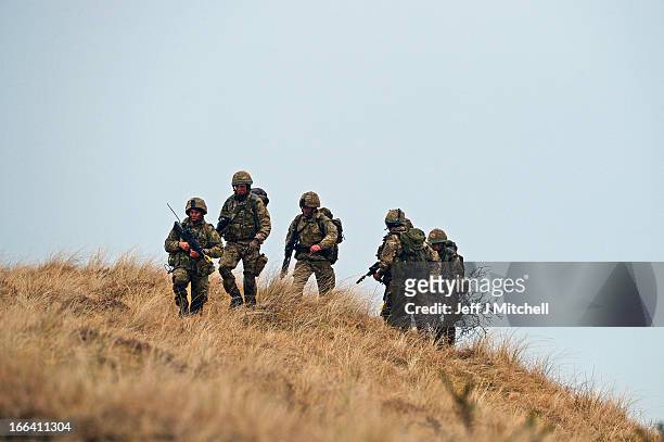Royal Marines from 42 Commando take part in an exercise at Barry Buddon simulating an attack on shores of a hostile country on April 12, 2013 in...