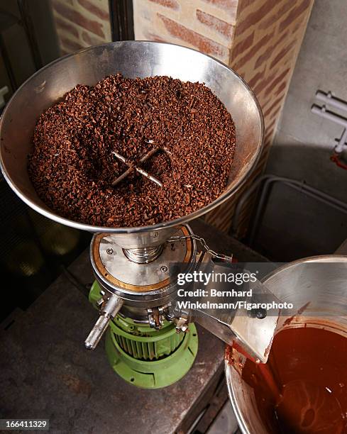 Figaro ID: 106545-010. Cocoa is photographed being turned into chocolate at Chef Alain Ducasse and pastry chef Nicolas Berger's chocolate store for...