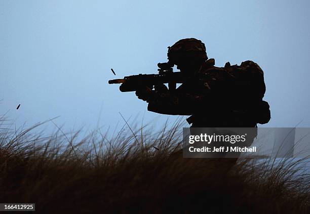 Royal Marine from 42 Commando takes part in an exercise at Barry Buddon simulating an attack on shores of a hostile country on April 12, 2013 in...