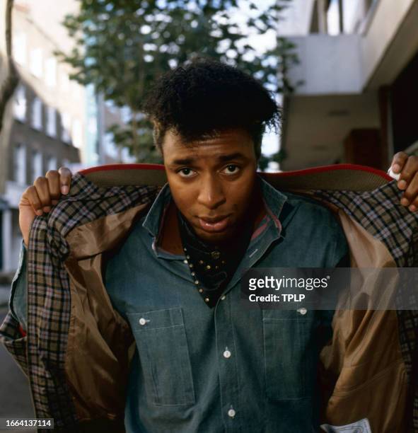 Portrait of British Pop singer and co-presenter of the 'Disco Dance World Championships 1983' Leee John, of the group Imagination, as he poses on a...