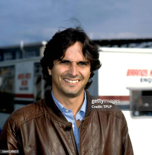 Portrait of Brazilian Formula One racing driver Nelson Piquet as he poses at Brands Hatch track, West Kingsdown, England, September 22, 1983.