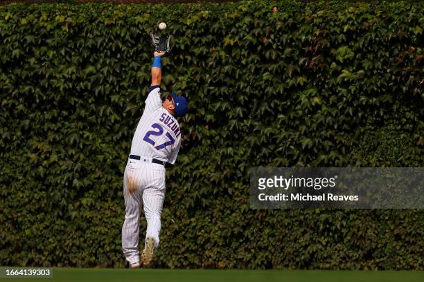 Seiya Suzuki of the Chicago Cubs catches a fly ball against the San Francisco Giants during the eighth inning at Wrigley Field on September 06, 2023...