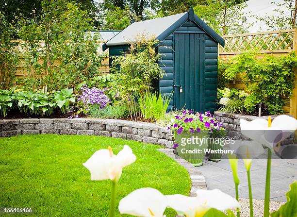 garden shed in a beautiful green garden - shed stock pictures, royalty-free photos & images