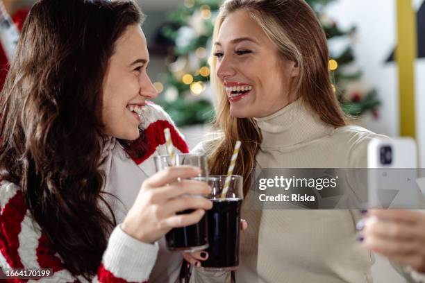 close up of two young woman having fun - pepsi stock pictures, royalty-free photos & images