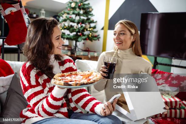 girl's night in. christmas celebration - pepsi stock pictures, royalty-free photos & images