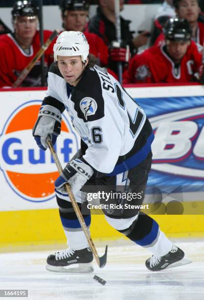 Martin St. Louis of the Tampa Bay Lightning stick handles the puck against the Buffalo Sabres on November 27, 2002 at HSBC Arena in Buffalo, New York.