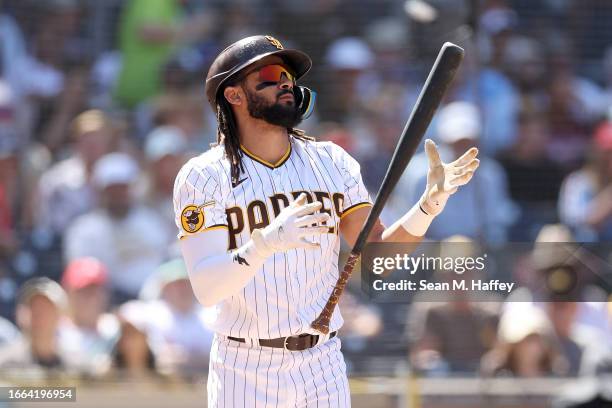 Fernando Tatis Jr. #23 of the San Diego Padres reacts to a strike during the fourth inning of a game against the Philadelphia Phillies at PETCO Park...