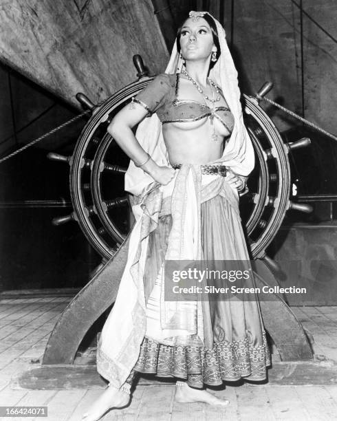 American actress Mary Ann Mobley wearing a harem outfit on the deck of a ship, circa 1970.