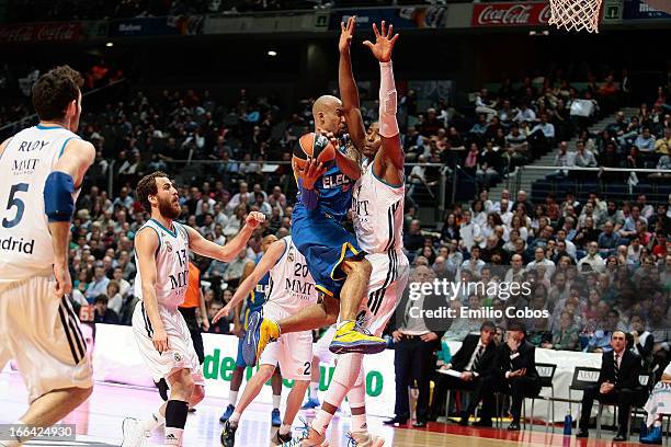 David Logan, #4 of Maccabi Electra Tel Aviv competes with Marcus Slaughter, #44 of Real Madrid during the Turkish Airlines Euroleague 2012-2013 Play...