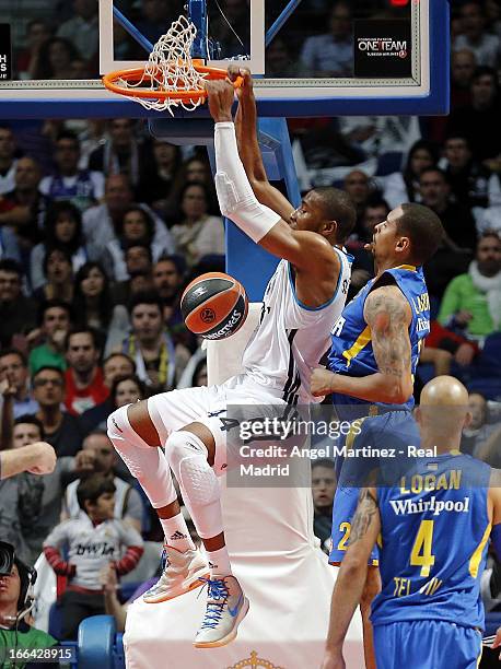 Marcus Slaughter of Real Madrid dunks the ball against Sylven Landesberg of Maccabi Electra Tel Aviv during the Turkish Airlines Euroleague Play Off...