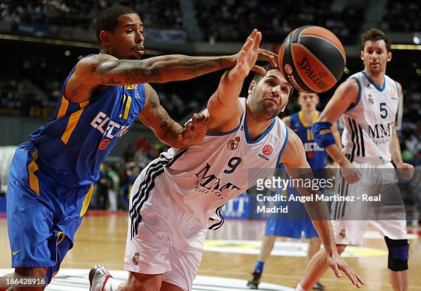 Felipe Reyes of Real Madrid rebounds with Sylven Landesberg of Maccabi Electra Tel Aviv during the Turkish Airlines Euroleague Play Off game 2 at...