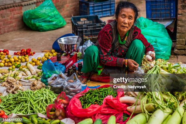 indian street sellers selling vegetables in bhaktapur, nepal - nepal food stock pictures, royalty-free photos & images