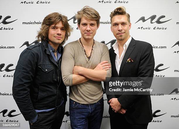 Zac Hanson, Taylor Hanson and Isaac Hanson of the band Hanson visit "U&A" at Music Choice on April 12, 2013 in New York City.