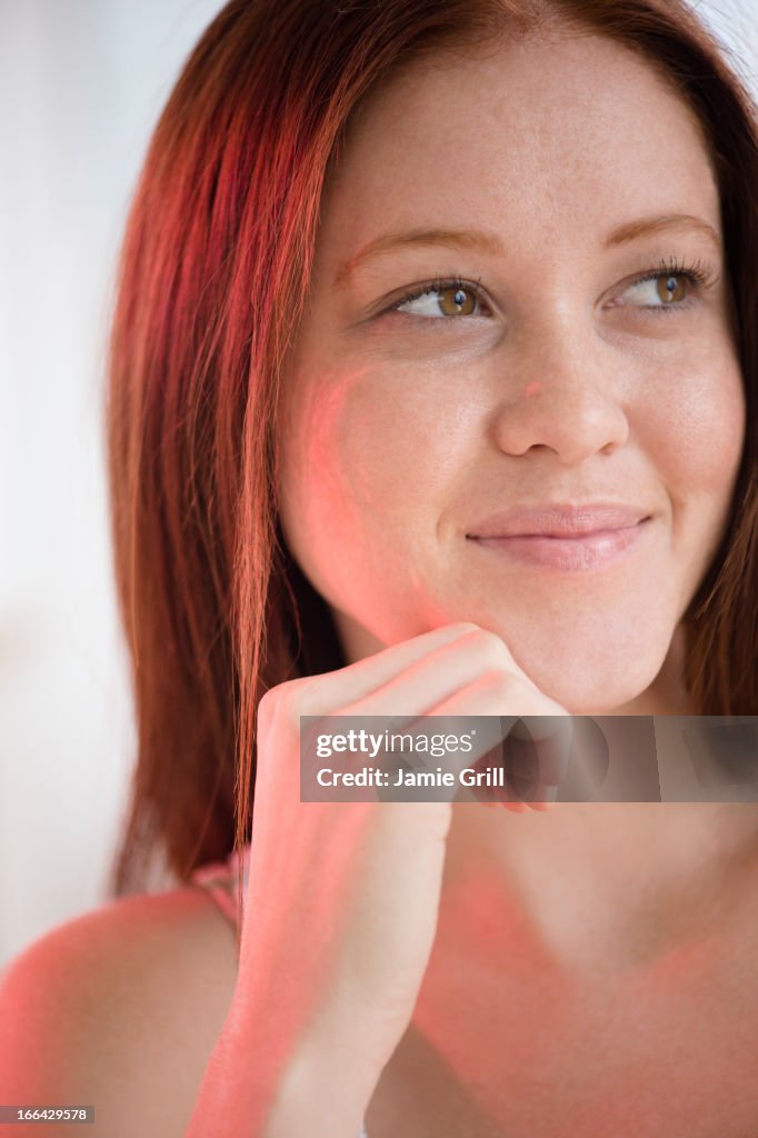 Woman smiling and looking away