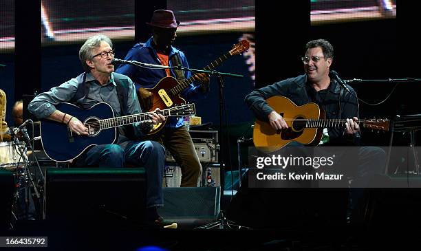 Eric Clapton and Vince Gill perform on stage during the 2013 Crossroads Guitar Festival at Madison Square Garden on April 12, 2013 in New York City.
