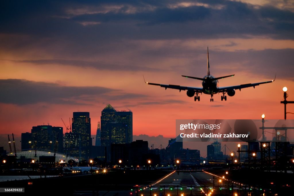 Landing airplane at dusk