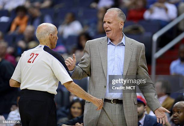 Philadelphia 76ers head coach Doug Collins shares a laugh with referee Dick Bavetta during the third quarter between the 76ers and Washington Wizards...