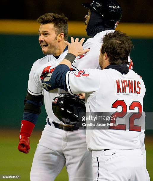 Nick Swisher, Michael Bourn and Jason Kipnis of the Cleveland Indians celebrate after Swisher hit a game-winning single in the ninth inning against...