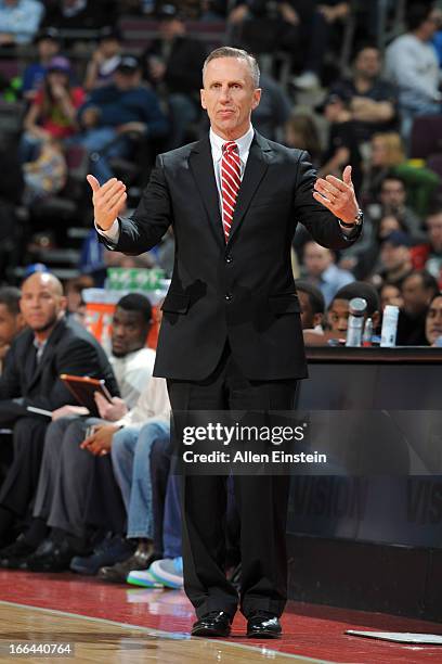 Mike Dunlap of the Charlotte Bobcats calls plays from the bench during the game against the Detroit Pistons on April 12, 2013 at The Palace of Auburn...