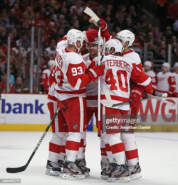 Members of the Detroit Red Wings including Johan Franzen, Carlo Colaiacovo and Henrik Zetterberg celebrate a 2nd period goal against the Chicago...