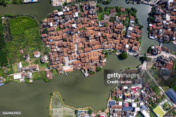 aerial view of farmland and rural houses by the river - asia village river bildbanksfoton och bilder