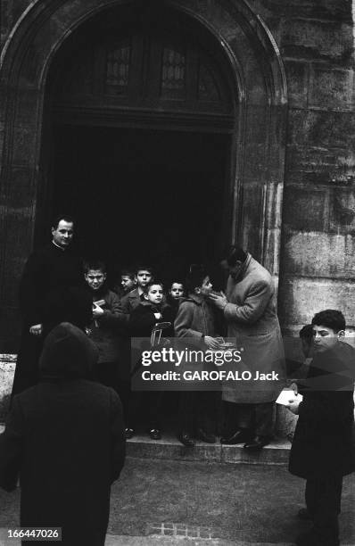 Rendezvous With Lino Ventura: With His Friends Wrestlers And With Family. Lino VENTURA avec son fils Laurent à la sortie de son cours de catéchisme :...