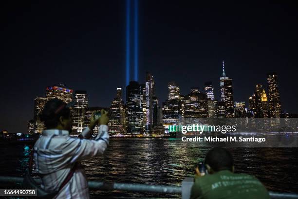 The Tribute in Lights are seen over the Manhattan skyline from Brooklyn Bridge Park as they are tested on September 06, 2023 in New York City. The...