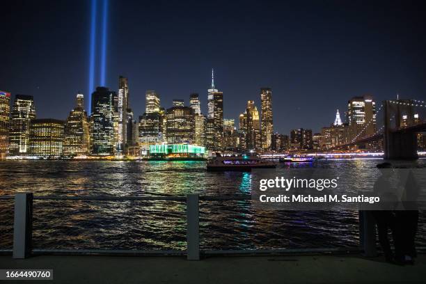 The Tribute in Lights are seen over the Manhattan skyline from Brooklyn Bridge Park as they are tested on September 06, 2023 in New York City. The...