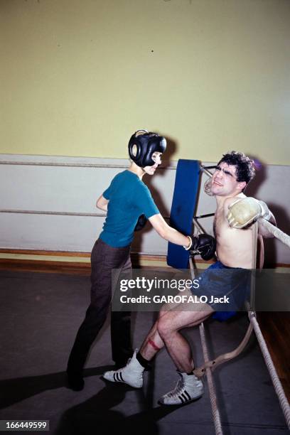Rendezvous With Jacques Marty And His Wife. En 1966, sur le ring d'une salle de boxe, le boxeur Jacques MARTY en short, adossé contre les cordes,...