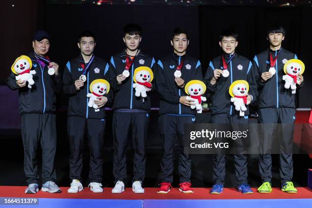 Silver medalists Lin Yun-ju, Kao Cheng-Jui, Chuang Chih-yuan, Yang Tzu-Yi, Huang Yan-Cheng of Team Chinese Taipei pose for a group photo during medal...