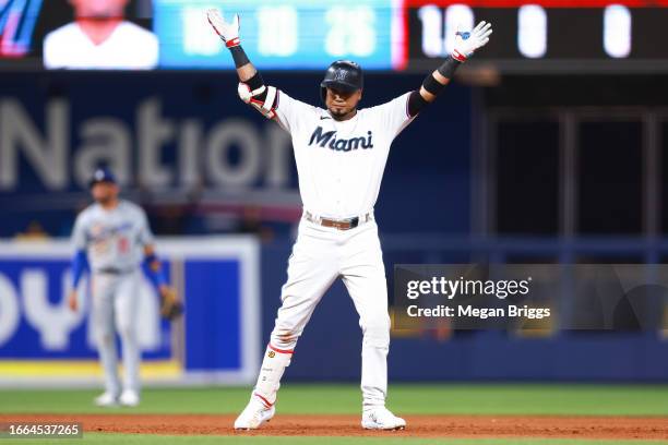 Luis Arraez of the Miami Marlins reacts after hitting an RBI double against the Los Angeles Dodgers during the fifth inning at loanDepot park on...