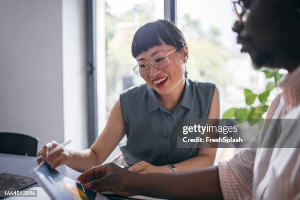 two colleagues working together in the office - market research stock pictures, royalty-free photos & images